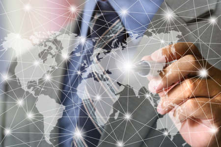 business man's hand writing world mapの写真素材