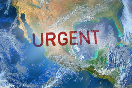 URGENT stamp on the earthの写真素材