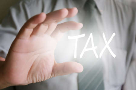 businessman hand, tax textの写真素材