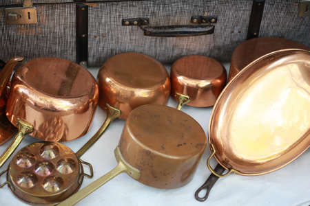 classic copper kitchenware set on tableの写真素材