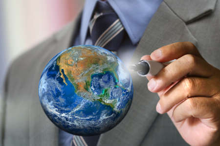business man's hand writing worldの写真素材