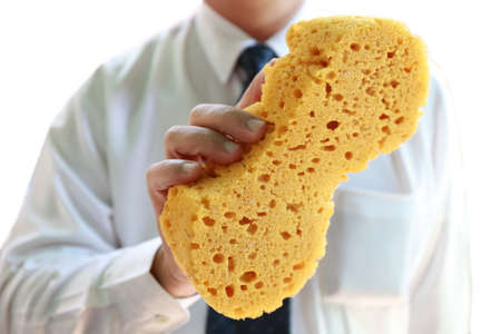 businessman with yellow spongeの写真素材