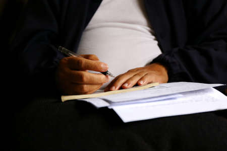 man write pen on document paperの写真素材