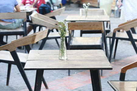 white flower vase on wood tableの写真素材