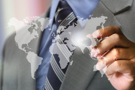 business man's hand writing world mapの写真素材