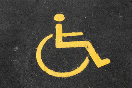 Handicapped symbol on parking space backgroundの写真素材