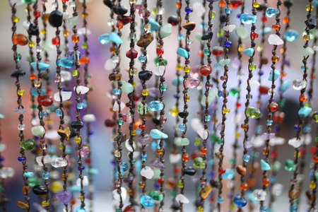 colorful gems stone hang background. arab metal necklace ,Beautiful Oriental jewelry Fashion Exotic Accessories color blind.の写真素材