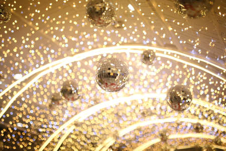 mirror disco ball hang on ceiling entrance tunnel with many small party light background, entertainment and enjoy night life star concert conceptの写真素材