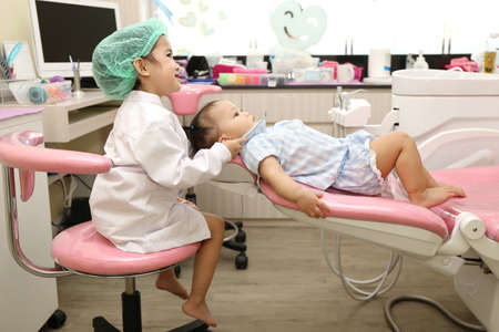 Asian girl group use dentist equipment to clean tooth for prevent toothache and good healthyの写真素材