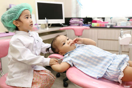 Asian girl group use dentist equipment to clean tooth for prevent toothache and good healthyの写真素材