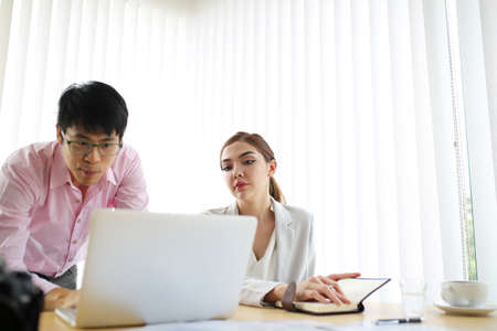 Happiness businessman and smart woman people group present explaining colleagues latest profit financial data in meeting room togetherness. Teamwork glad success job. good result profit.の写真素材