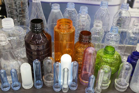 many size plastic tube material for make drink water bottle in factory background conceptの写真素材