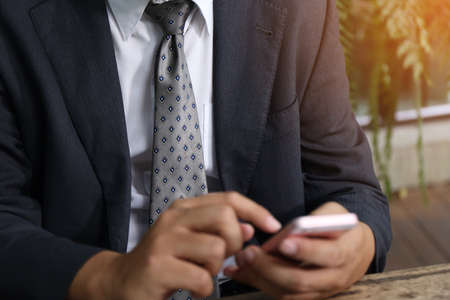 banker businessman people group working with laptop and financial document chart on wood table together.の写真素材