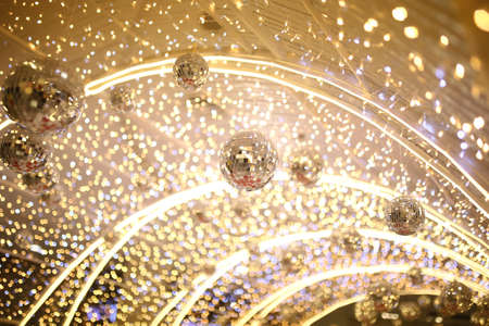mirror disco ball hang on ceiling entrance tunnel with many small party light background, entertainment and enjoy night life star concert conceptの写真素材