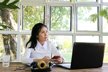 Smart young businesswoman crew working with new startup project in modern loft office. Generic design notebook education and inspiration lifestyle. Europe and European people.の写真素材