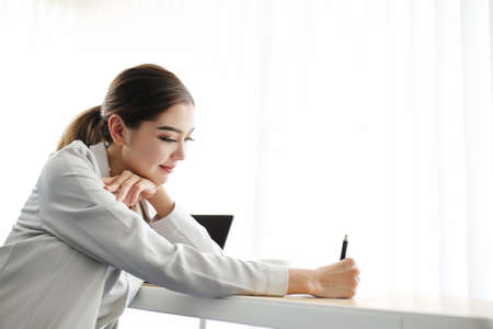 Happiness graceful businessman and smart woman people group present explaining colleagues latest profit financial data standing with dignified manner in office, Teamwork glad success job.の写真素材