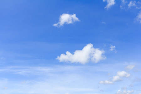 White clouds against a blue skyの写真素材