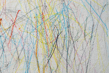 Drawing with colored pencil on the wall of a child.