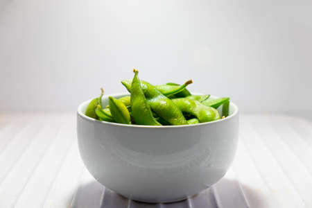 Green Japanese Soybean in white bowl in refrigeratorの写真素材