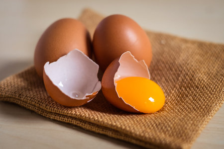 Close up of cracked egg on a Sack