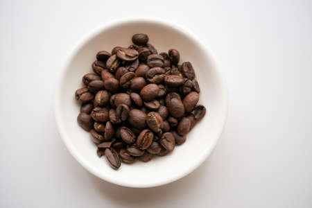 Coffee beans on a plateの写真素材