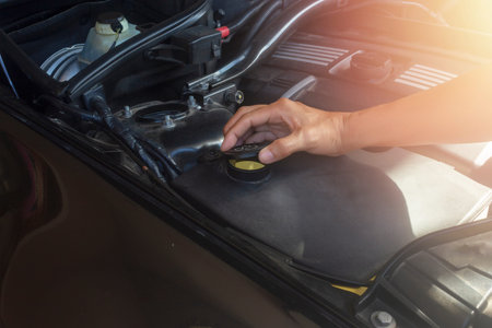 Car repair service, Hand man checking water level