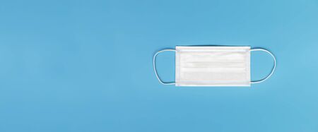 Medical mask isolated on blue background , Medical face mask isolated with copy spaceの写真素材