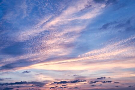Sky with cloud and sun ray yellow and blue color background. With copy space for text or design.の写真素材