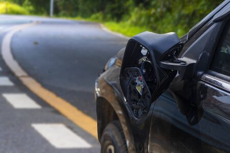 Car accident broken car rearview mirror. car accident on road.の写真素材