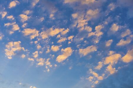 Sky with cloud and sun ray yellow and blue color background. With copy space for text or design.の写真素材