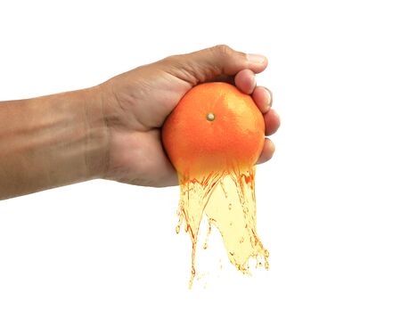 Hand man squeezes orange isolate on white background.の写真素材