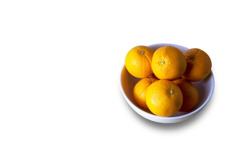 Orangs in white bowl isolate on white background.の写真素材