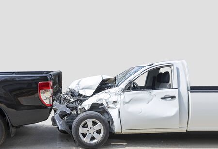 Front White color pack up car crash with back side black color car get damaged by accident on city street. isolate on gray backgroundの写真素材
