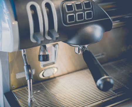 Close-Up of coffee machine in the coffee shop. len blur effect Soft focus and focus to Steam Milk...