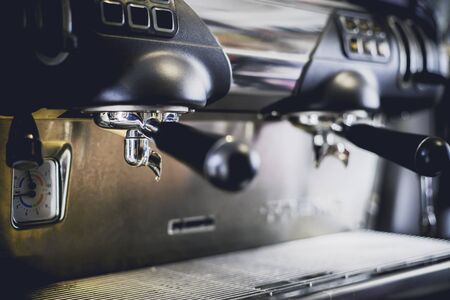 Close-Up of coffee machine in the coffee shop. len blur effect. Process with vintage styleの写真素材