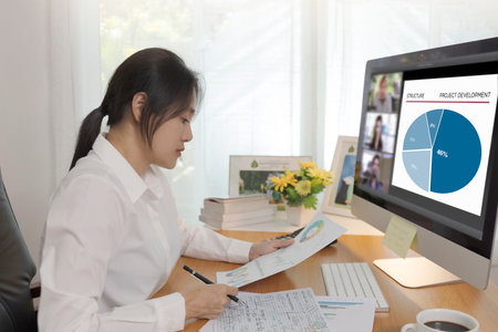 Asian business women working at home online meeting with video conference on computer. Business...