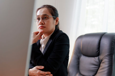 Tired women worker from headache or migraine at workplace. Female employees have problems from work....