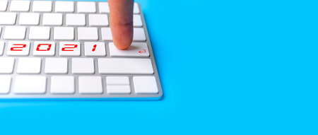 Finger hand man point ENTER on keyborad for new year 2021. Happy new year start up concept. With...
