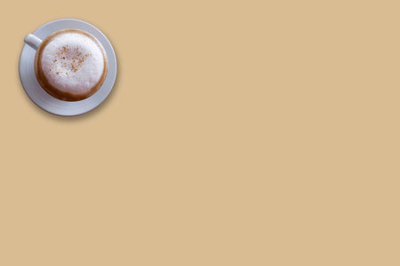 Top view of latte, cappuccino coffee in white cup on brow background. With copy spaceの写真素材