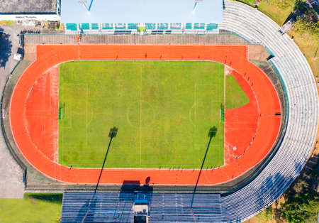 Aerial drone top down view of soccer stadium. Football stadium  with running field  shot with drone at Phuket Thailandの写真素材