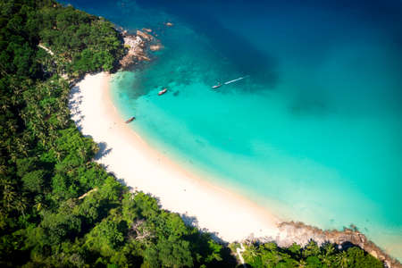Aerial drone top view crowd of happy people relax at tropical Beach with sunset in Phuket, Thailand, Beautiful Phuket beach is famous tourist destination at Andaman sea. Holiday summer conceptの写真素材