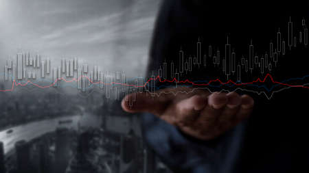 Businessman show stock market bar chart grow up to target. Business finance concept. Businessman's hands Show success graph, stocks grow every yearの写真素材
