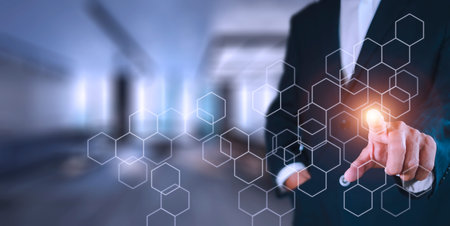 Businessman pressing button on hologram virtual screens with hexagons and transparent. Business...