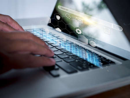 Hand man using laptop with search bar connect to social media, social network Online marketing concept Man hand holding laptop with search bar Lifestyle business concept copy space bannerの写真素材