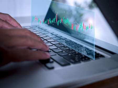 Businessman show stock market bar chart grow up to target. Business finance concept. Businessman's hands Show success graph, stocks grow every year and set goalsの写真素材