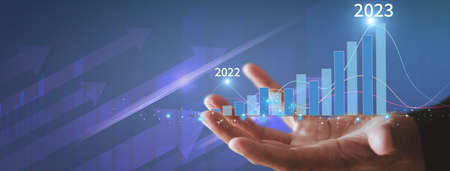 Businessman show golden stock market bar chart grow up to target. Business finance concept. Businessman's hands Show success graph, stocks grow every year With copy space bannerの写真素材