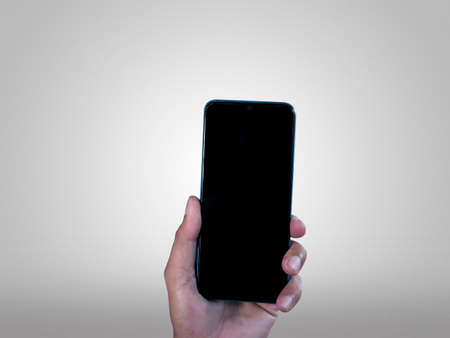 Hand businessman showing smartphone with blank screen, isolated on white background, copy space clipping pathの写真素材