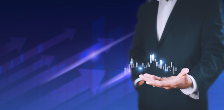 Businessman show stock market bar chart grow up to target. Business finance concept. Businessman's hands Show success graph, stocks grow every year With copy space bannerの写真素材