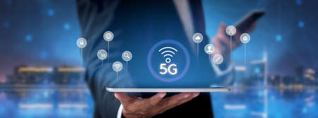 Business network communication concept. 5G Network Internet Mobile Wireless. 5g internet connects all activities in your hands shopping, finance, travel, location, contact, etc with copy space bannerの写真素材