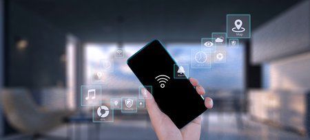 Man hand show smartphone smarth home GUI control every room in house. Hand use smart screen smart home automation assistant on a virtual screen and a user touching a buttonの写真素材